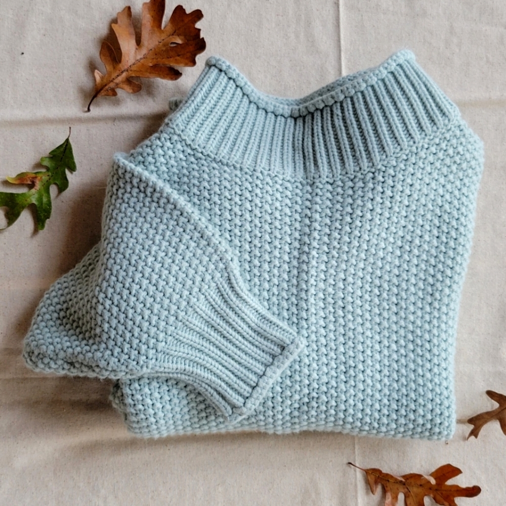 Light mint knit turtleneck sweater with bubble sleeves